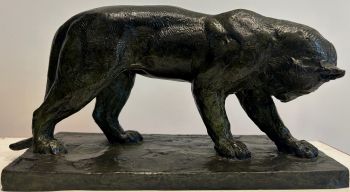 A bronze panther, with a nuanced green and textured patina. by Roger Godchaux