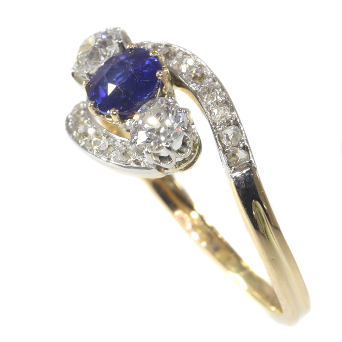 Vintage Belle Epoque cross over ring with brilliant cut diamonds and high quality natural sapphire by Unknown Artist