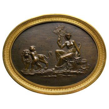  A French Empire bronze and gilded oval plaque with Cybele by Unknown Artist