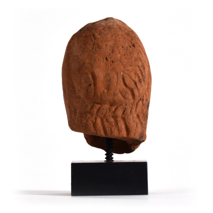  A Roman-Egyptian terracotta head of Alexander the Great, - by Onbekende Kunstenaar