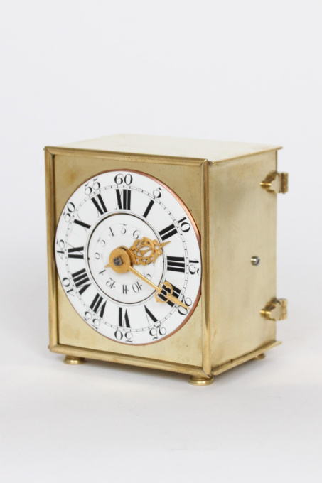 A rare and small German brass travel alarm clock with travel case, circa 1770 by Onbekende Kunstenaar