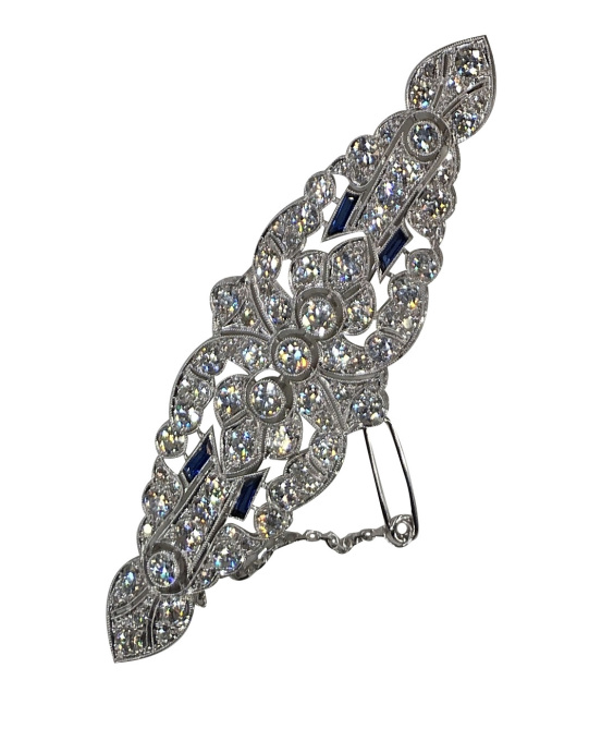 Vintage platinum Art Deco diamond brooch with sapphire accents by Unknown artist