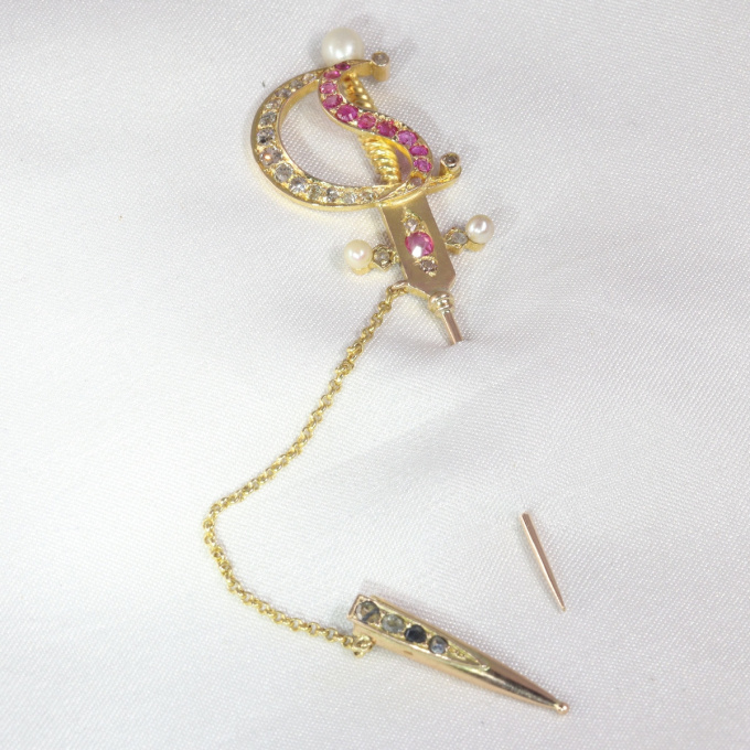Antique gold pin in the shape of a bejeweld sword by Unknown Artist