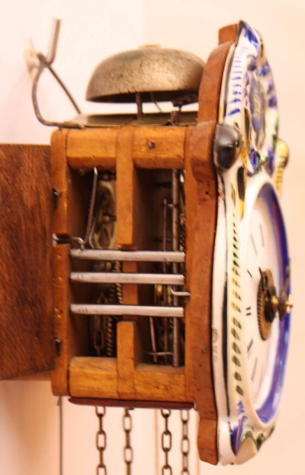 A small German polychrome striking and alarm wall clock, circa 1860 by J.M.