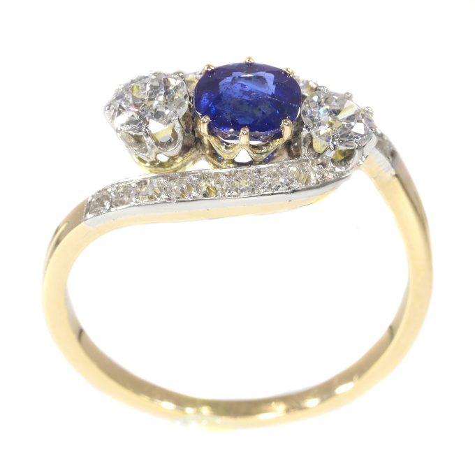 Vintage Belle Epoque cross over ring with brilliant cut diamonds and high quality natural sapphire by Unknown Artist