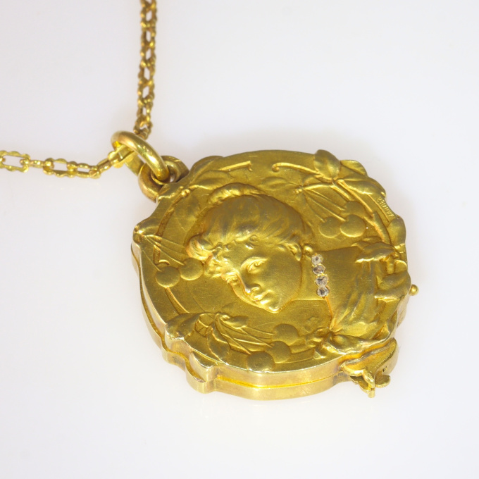 French gold chain and locket with rose cut diamonds depictging a woman, late 19th Century signed Janvier by Artiste Inconnu