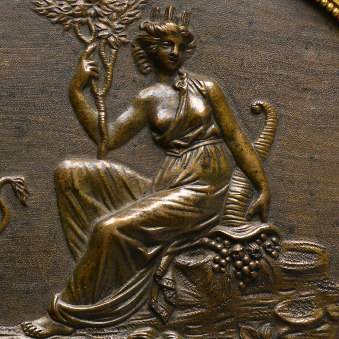  A French Empire bronze and gilded oval plaque with Cybele by Unknown Artist