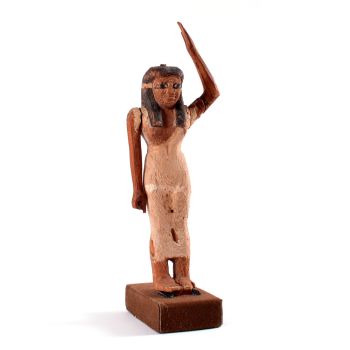 An Egyptian wooden female offering bearer figure, Middle Kingdom by Artista Desconocido