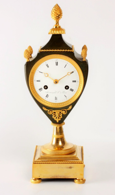 A fine French Empire ormolu and bronze urn mantel clock, circa 1800 by Armingaud Láîné à Paris