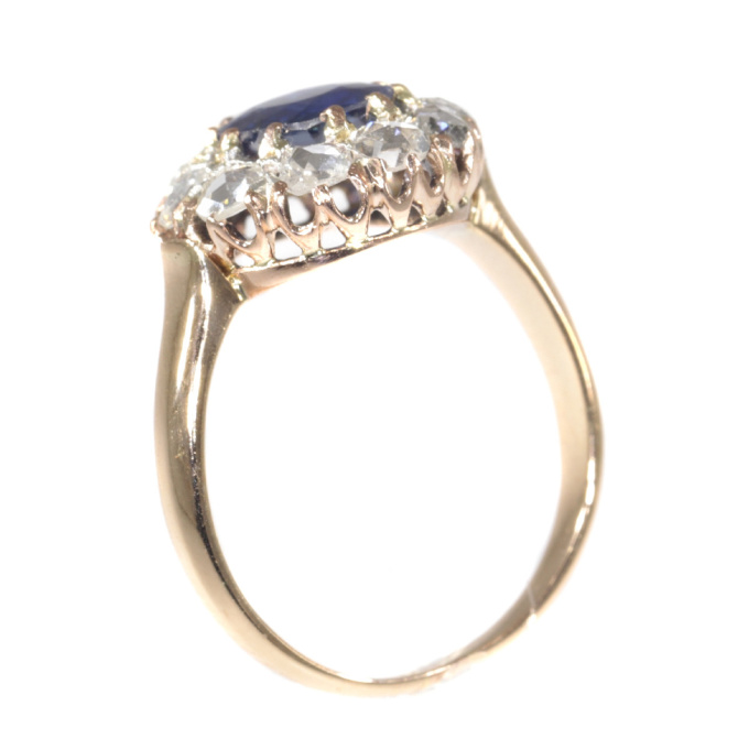 Victorian antique engagement ring with natural sapphire and ten rose cut diamonds by Onbekende Kunstenaar