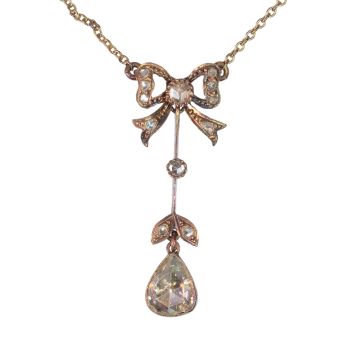Era of Elegance: 1890s Victorian Bow and Pear Diamond Pendant by Artiste Inconnu
