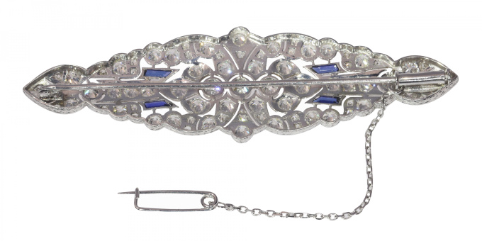 Vintage platinum Art Deco diamond brooch with sapphire accents by Artiste Inconnu