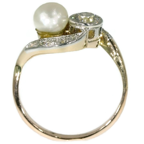 Romantic engagement ring with diamonds and pearl by Unknown Artist