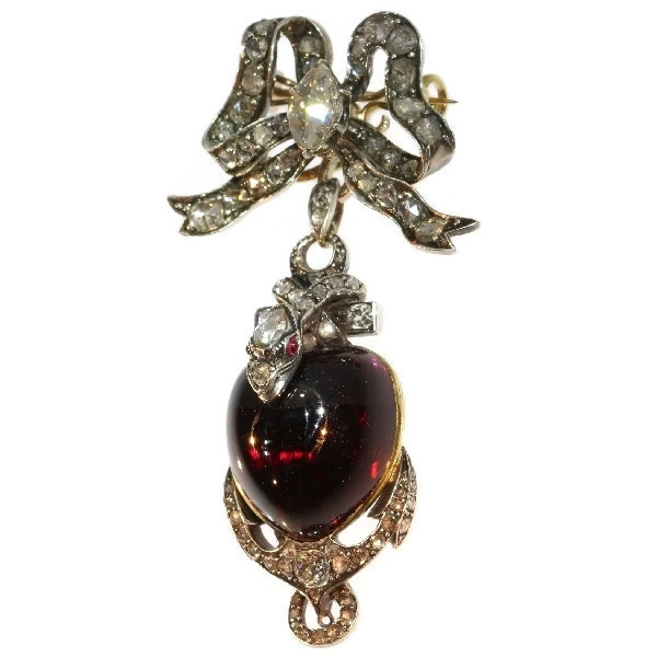 Early-Victorian diamond brooch-pendant medallion large heart shaped garnet cabochon snake anchor and bow by Artista Sconosciuto