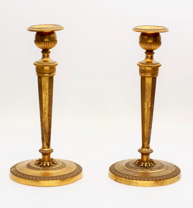 A pair French empire fire-gilt candlesticks, circa 1800 by Unknown artist