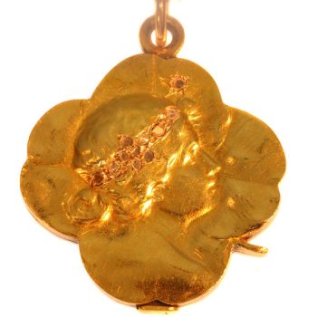 Art Nouveau gold slide locket four leaf clover with woman head by Artista Desconocido