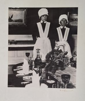 Parlourmaid and under-parlourmaid ready to serve dinner by Bill Brandt