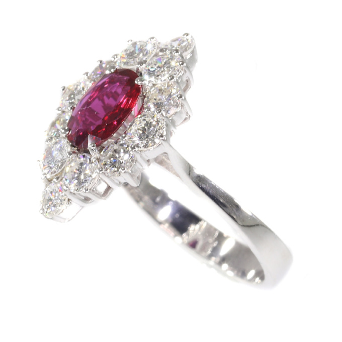 Vintage 1970's ring with beautiful ruby and set with 12 brilliant cut diamonds by Unknown artist