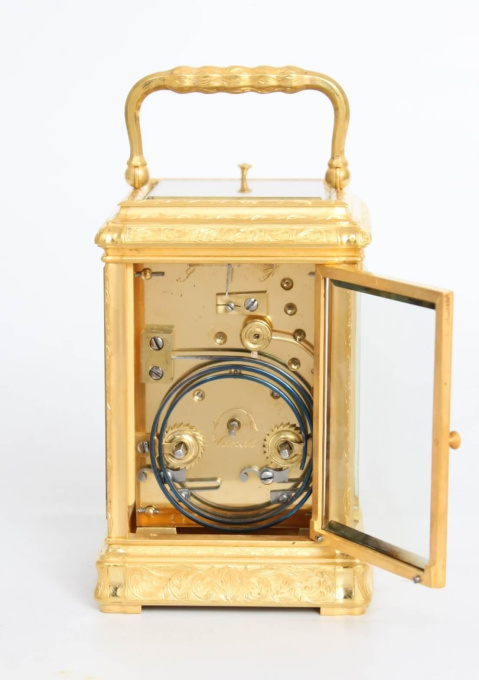 A French engraved gilt brass gorge case carriage clock, circa 1870 by Onbekende Kunstenaar