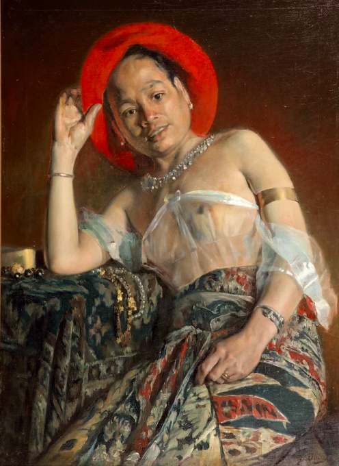 Portrait of a Balinese model wearing batik and gold bracelets by Henri Jean-Joseph Ubaghs