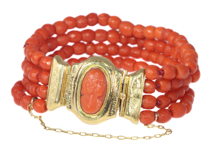 Antique four string coral bracelet with coral cameo in 18K gold closure by Artista Sconosciuto