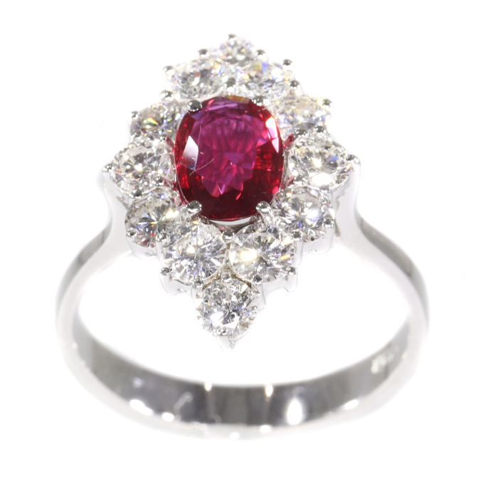 Vintage 1970's ring with beautiful ruby and set with 12 brilliant cut diamonds by Artiste Inconnu