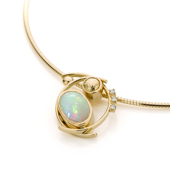 Yellow gold pendant with opal and diamond by Sabine Eekels