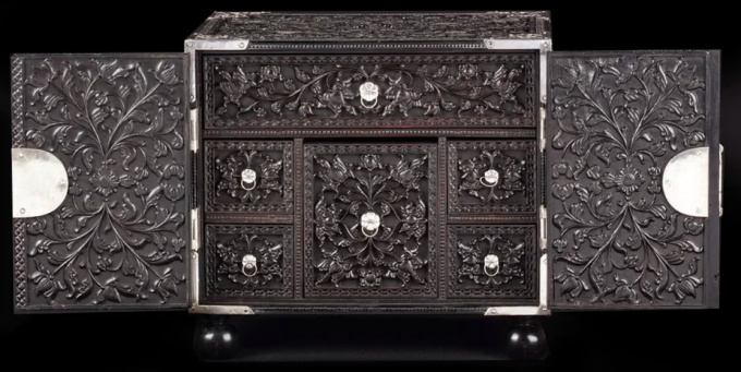  A splendid Dutch-colonial Sinhalese ebony two-door cabinet with silver mounts by Artiste Inconnu