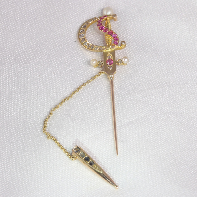 Antique gold pin in the shape of a bejeweld sword by Unknown Artist