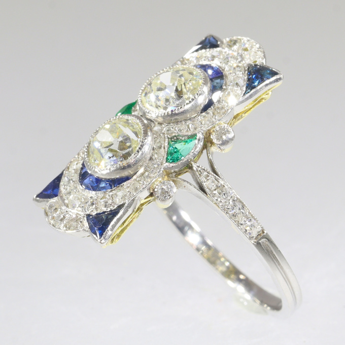 Vintage Art Deco strong design platinum ring with brilliant cut diamonds sapphires and emeralds by Unknown Artist