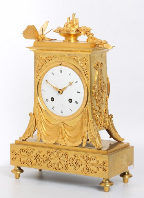A French Empire ormolu mantel clock with butterfly, circa 1800 by Unknown Artist